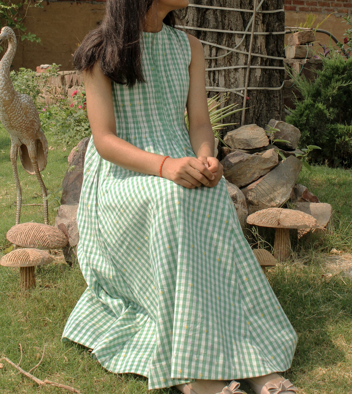 Natural fabric of Neva Midi Dress glowing in golden hour light