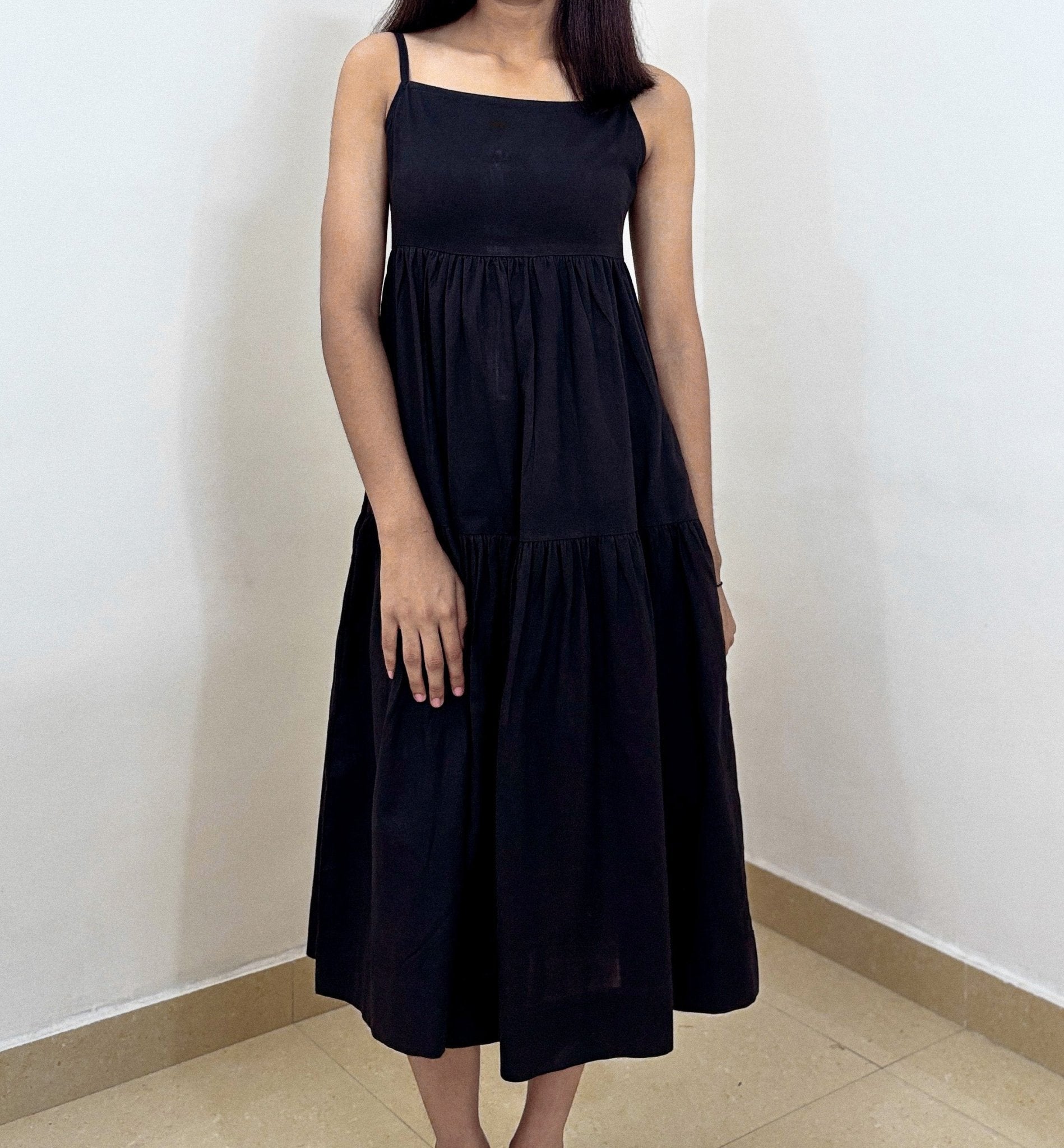 Model wearing Aria Midi Dress – front view in studio lighting