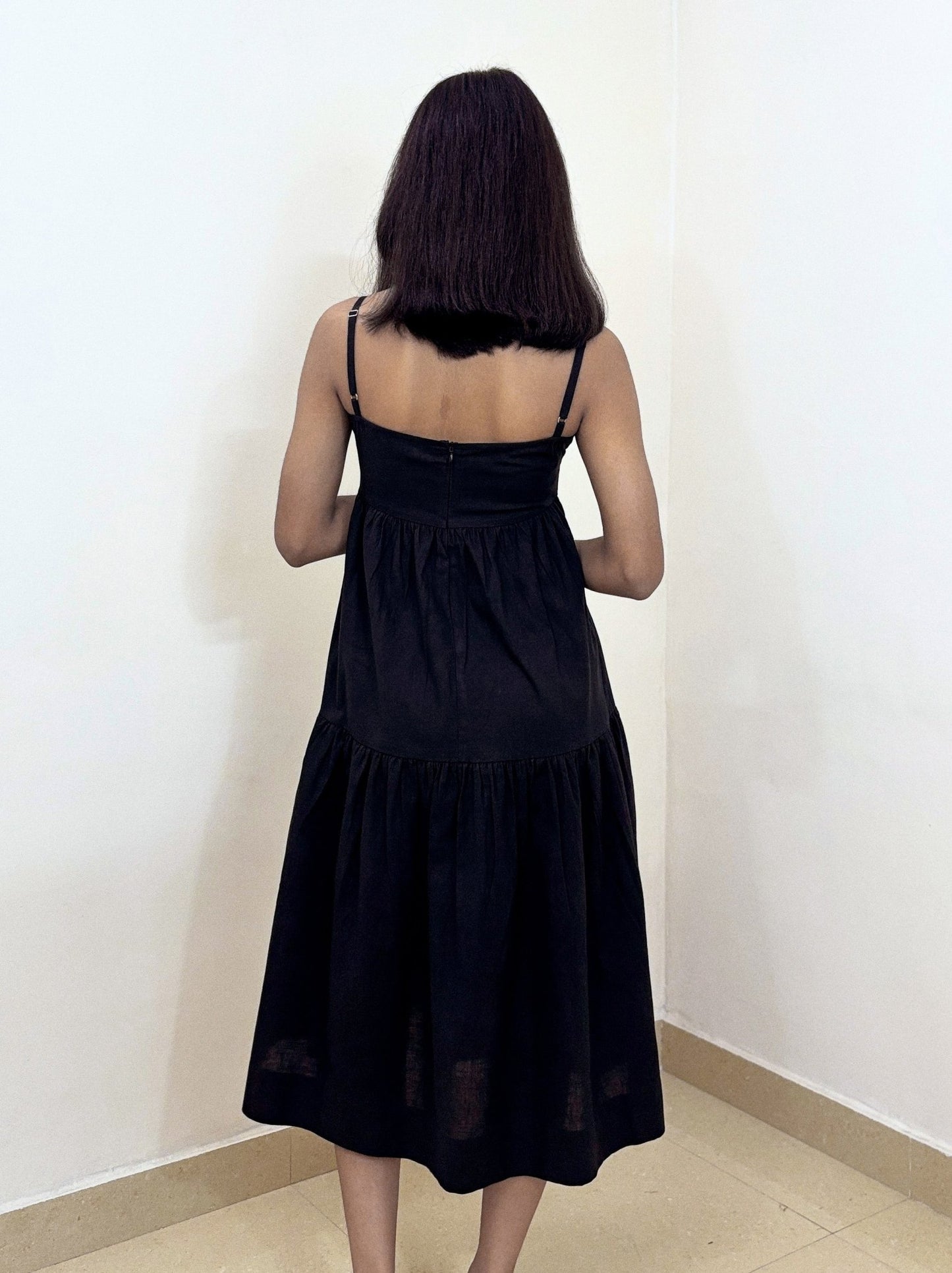 Back view of Aria Midi Dress worn by model in studio