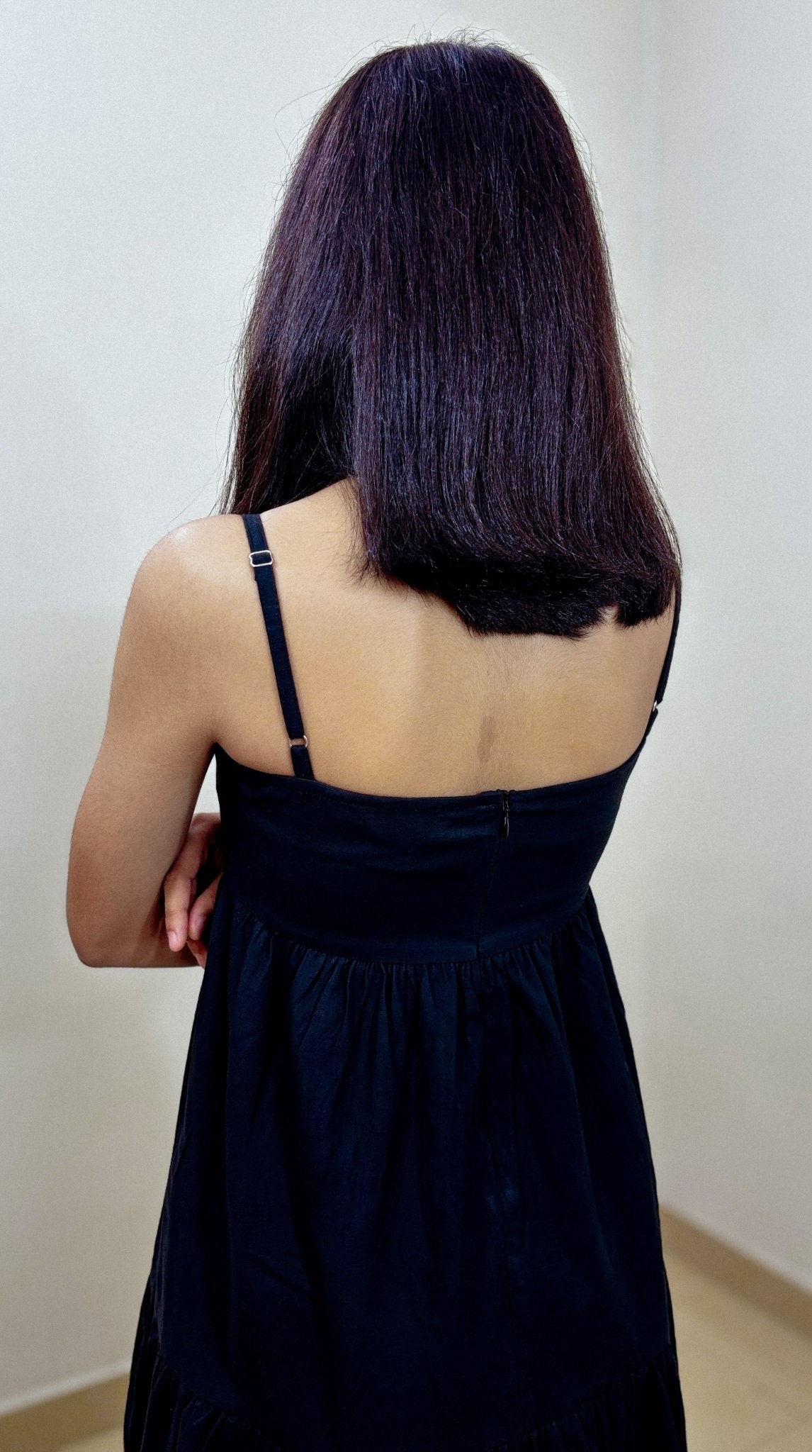Close-up of fabric texture and stitching on Aria Midi Dress in studio