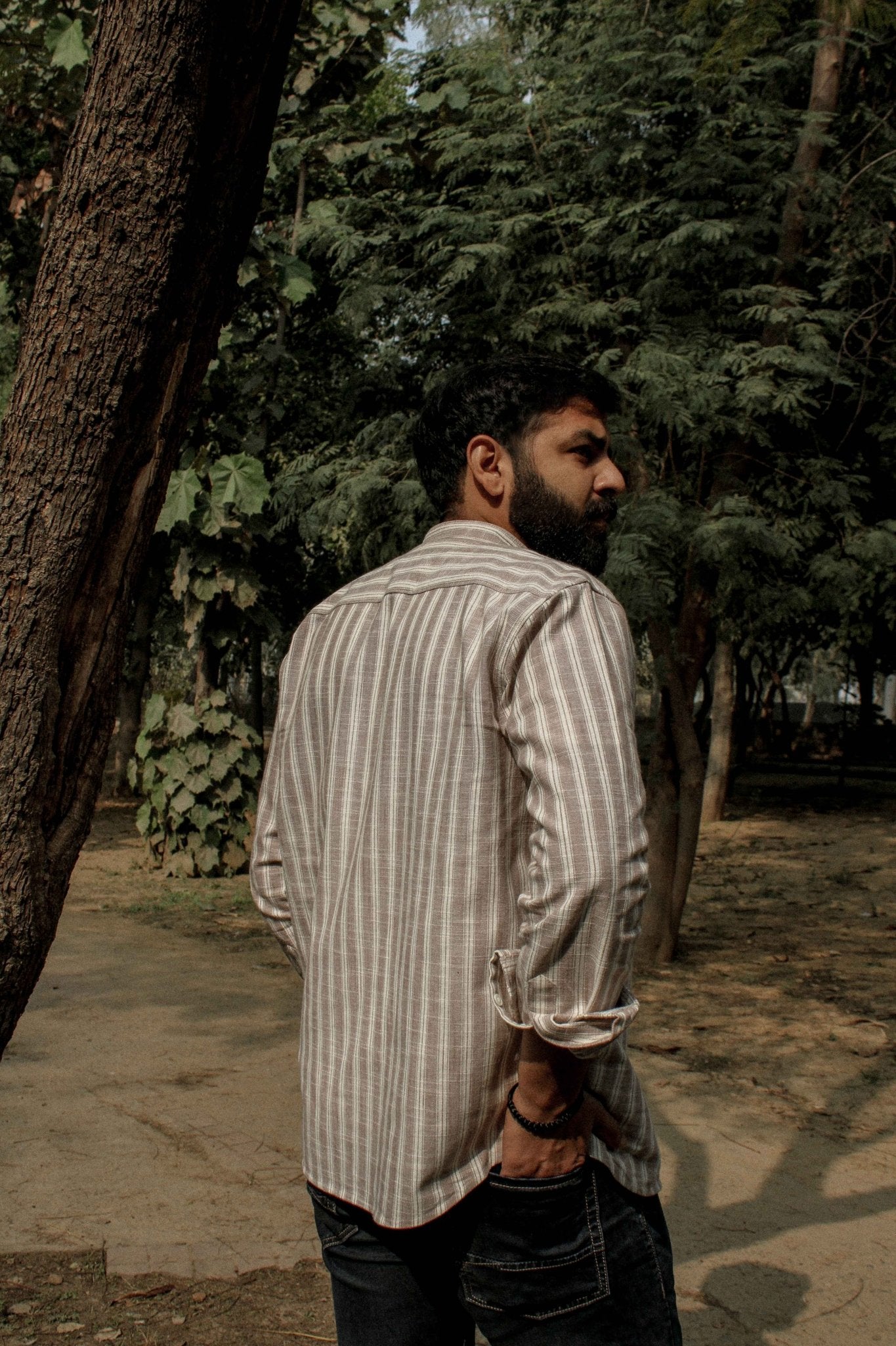 Back view of Dhar linen shirt highlighting stripe design