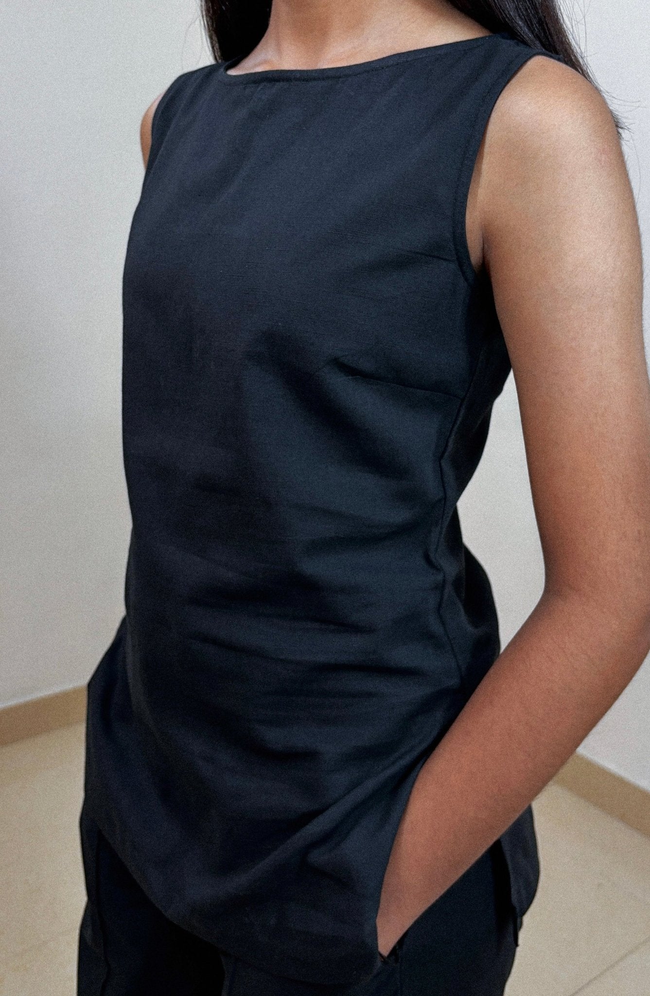 Close-up of black linen cotton fabric texture on Nerve ensemble in studio light