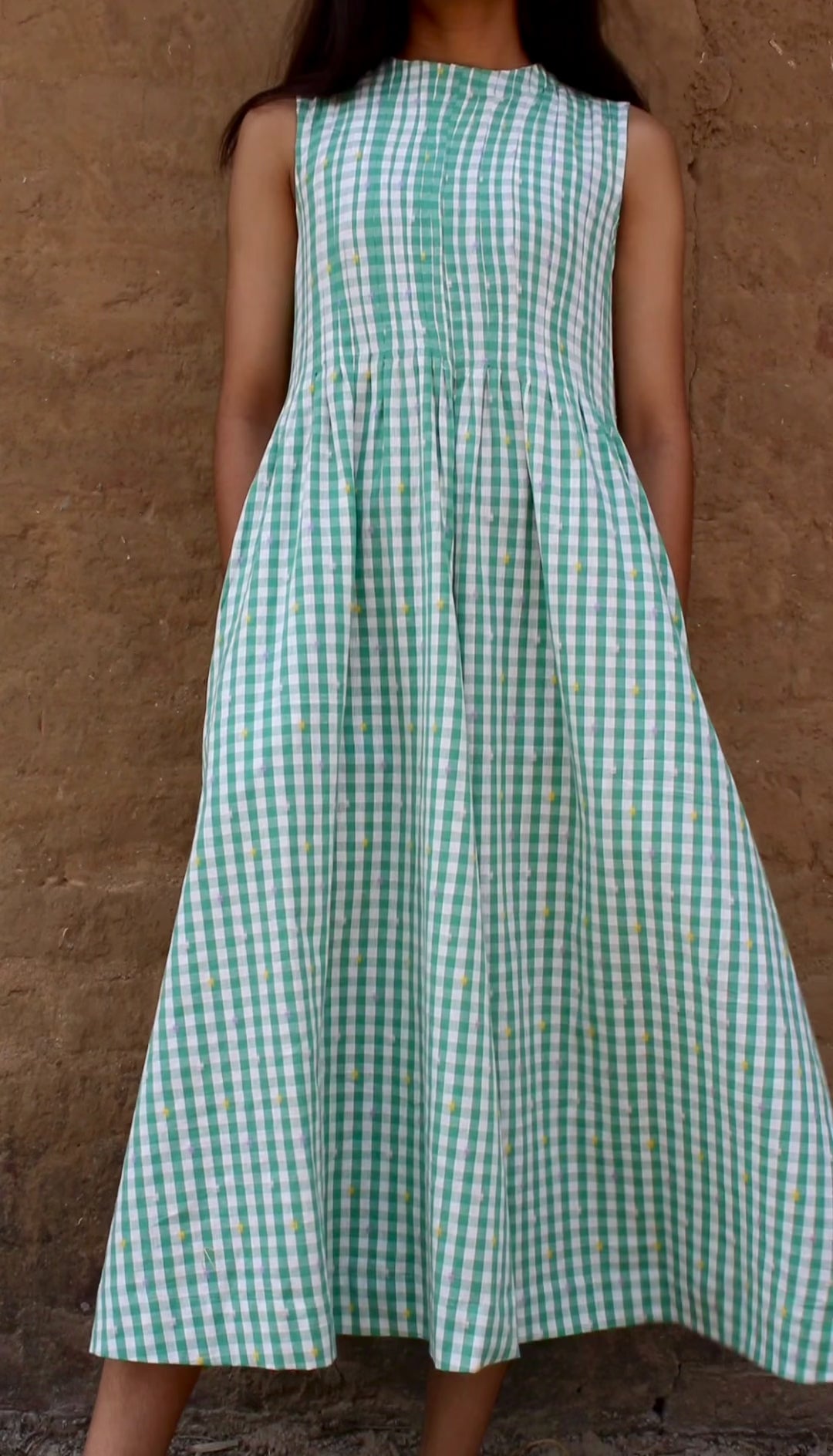 Neva Midi Dress captured in motion – timeless style in natural surroundings