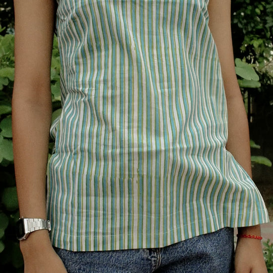 Model wearing the Nirv Blouse in natural light – soft, elegant movement