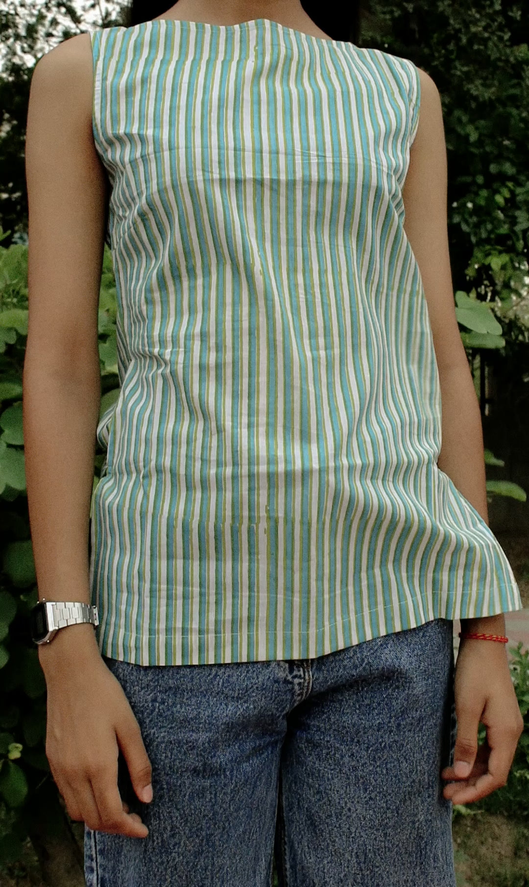 Model wearing the Nirv Blouse in natural light – soft, elegant movement
